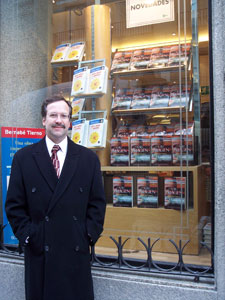 The author in Madrid, Spain, in front of a store window display of his novel A Su Imagen (In His Image).